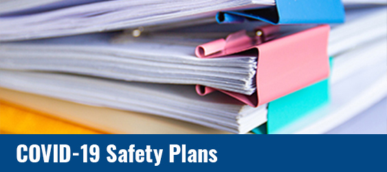 Photo of A stack of papers with COVID-19 Safety Plan text over it